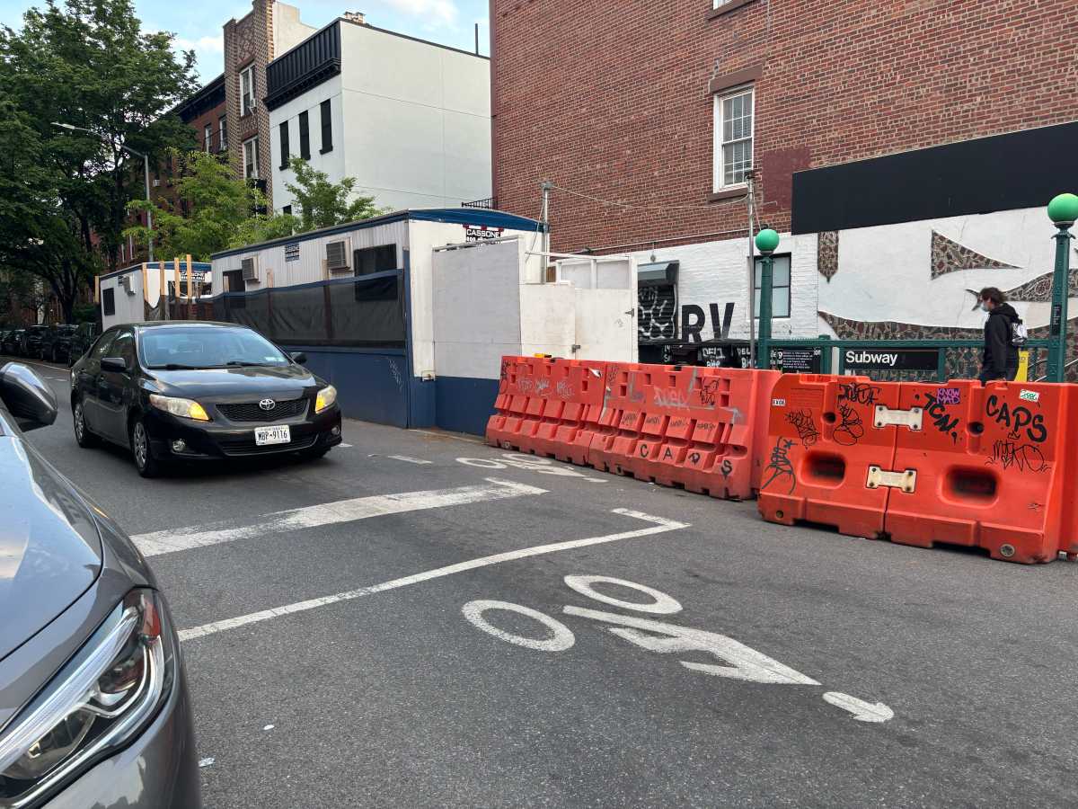 car traveling on Brooklyn street that will be turned into a bike boulevard