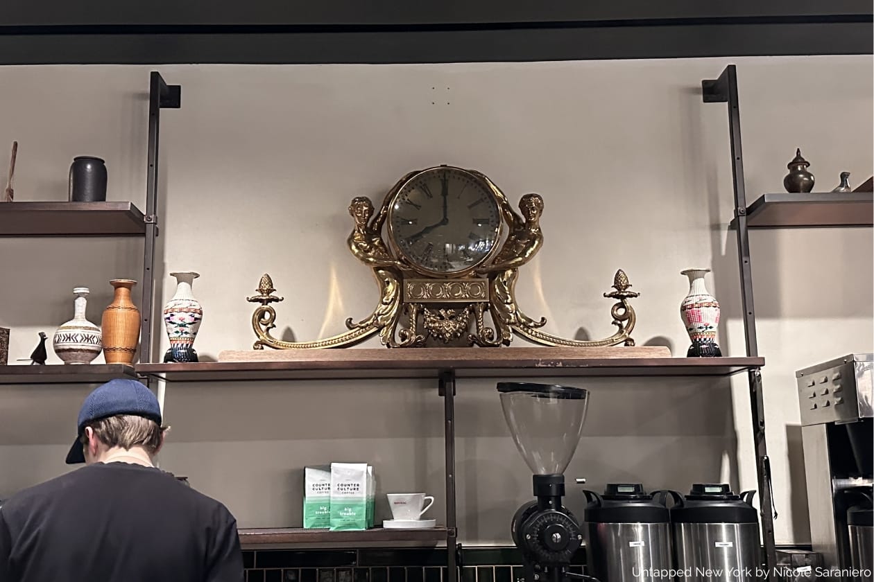 Iconic gilded lobby clock from the Biltmore Hotel, now inside a cafe at 22 Vanderbilt