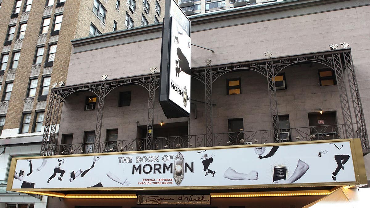 Michael James Scott standing under theatre marquee at Eugene O'Neill Theatre in New York City