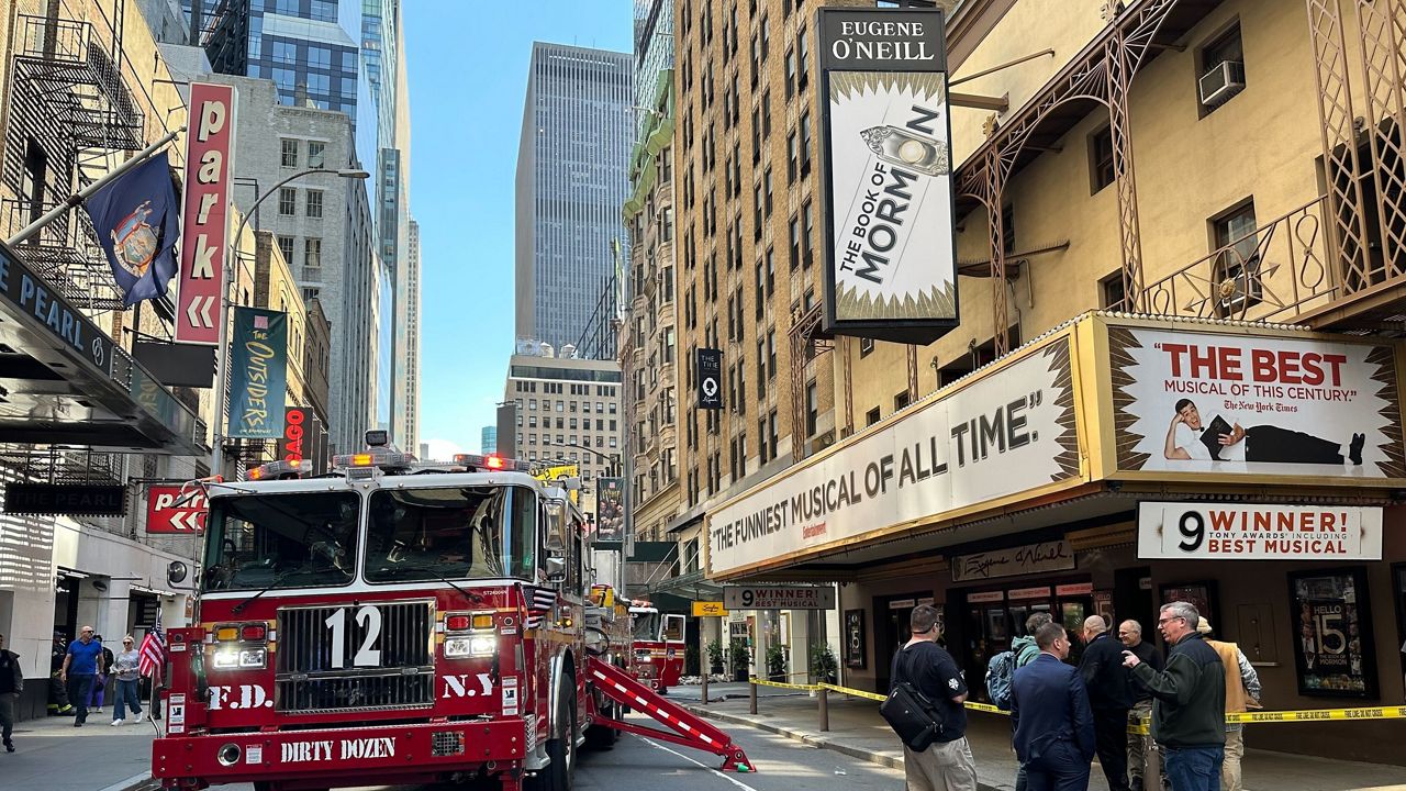 Firetrucks are parked outside of the Eugene O'Neill Theatre in New York on Monday, May 4, 2026. (AP Photo/David Martin)