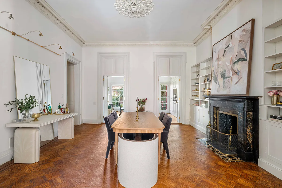 dining room with ceiling medallion, black marble mantel