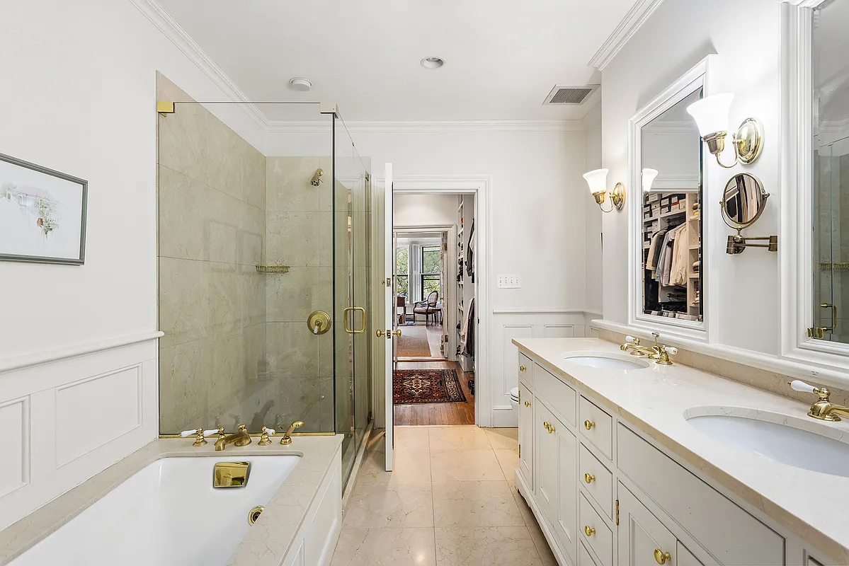 bathroom with neutral finishes and door to walk-in closet