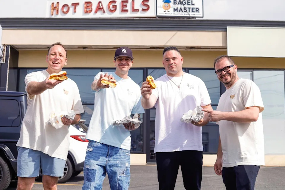 Competitive eater Joey Chestnut, seen with Robke’s owner Louie Selvaggio, GOAT USA founder TJ Cristina, declared Long Island bagels “might be the best” after a recent tour. GOAT USA