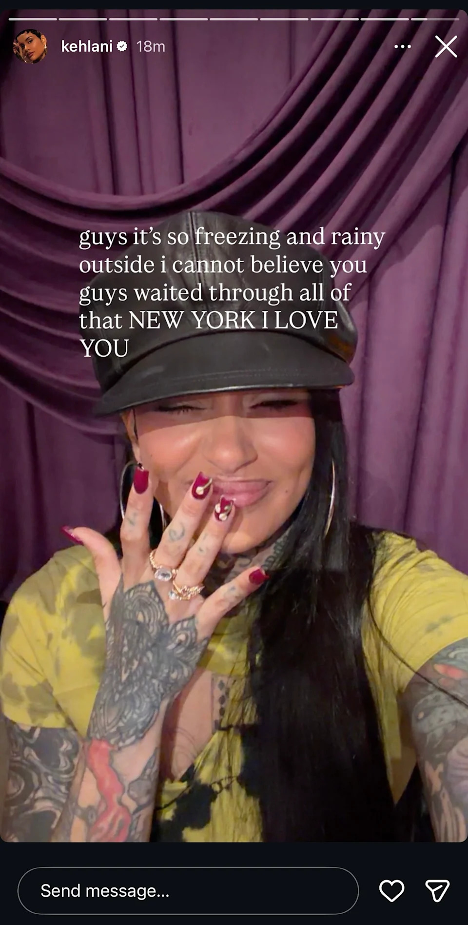 Kehlani smiling with a hand over her mouth, wearing a cap and showing tattoos. Text about New York and weather.