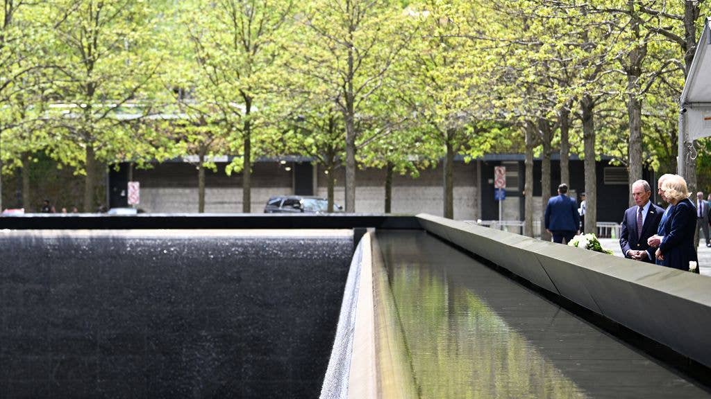 King Charles and Queen Camilla at the memorial pool