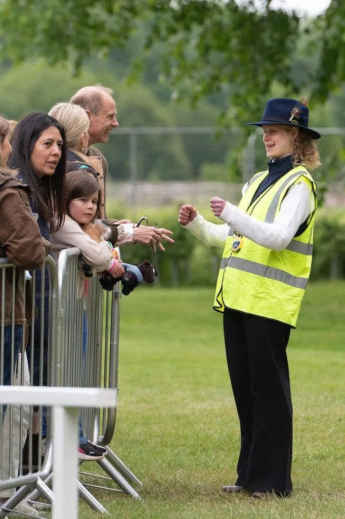 Prince Edward laughing as Lady Louise Windsor makes geatures with her hands