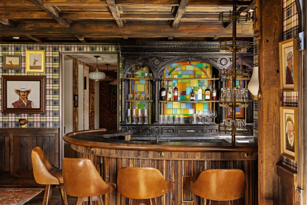 Interior of a rustic bar area with a wooden finish.