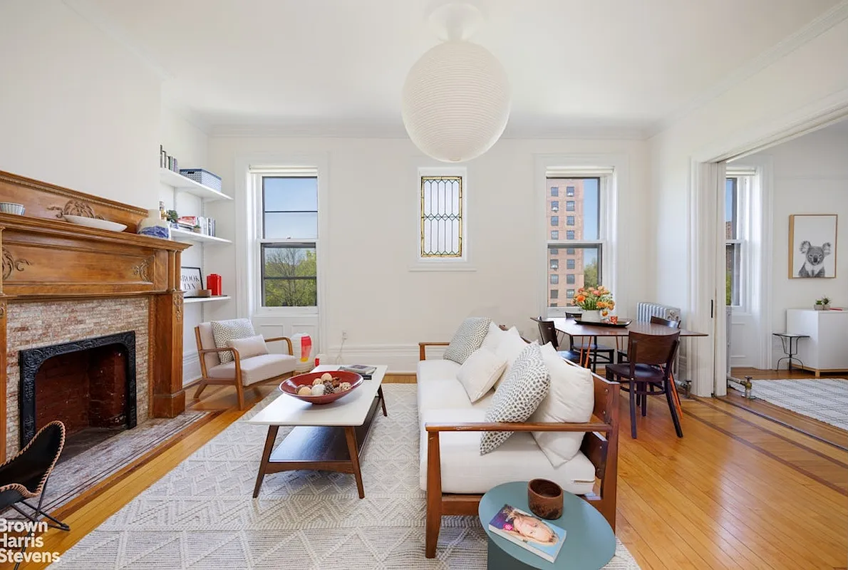 clinton hill - living room with wood mantel, wood floor