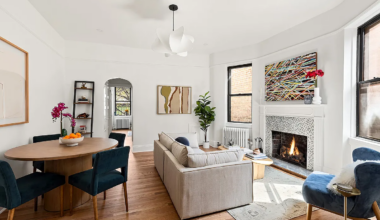 living room with fireplace, white walls, picture rails
