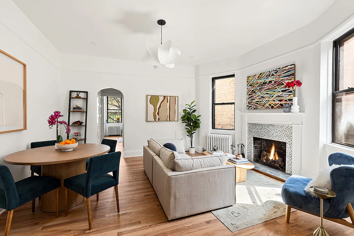living room with fireplace, white walls, picture rails