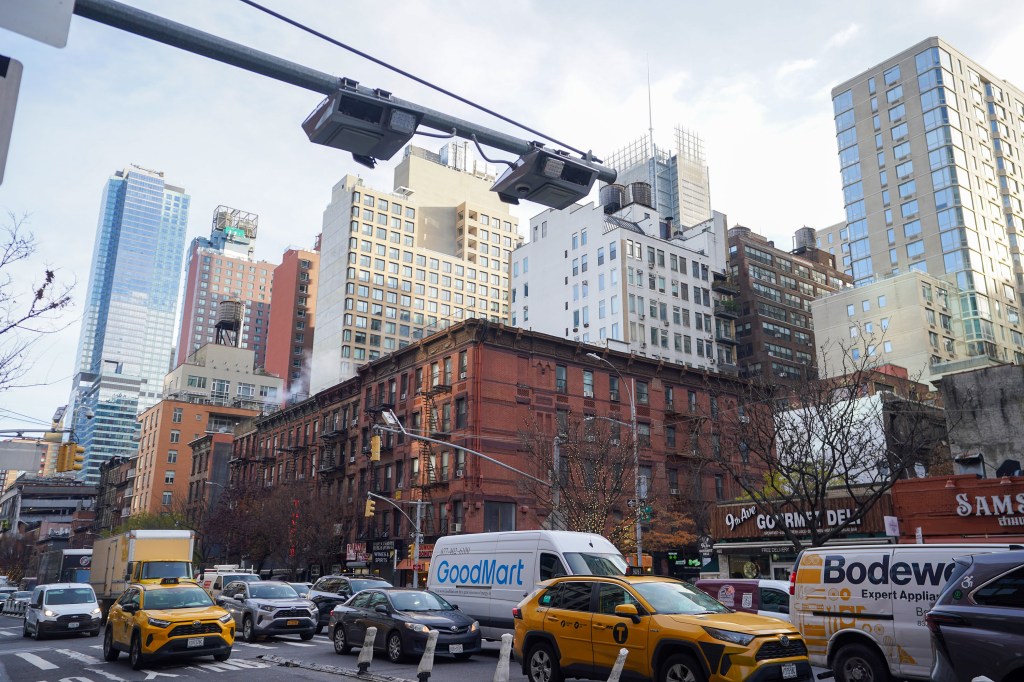 An overhead toll reader on 9th Avenue at approximately West 37th Street, Manhattan.