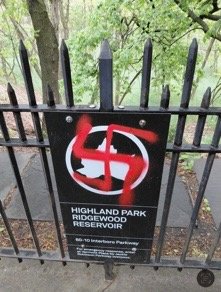 Five swastikas were found painted near the Ridgewood Reservoir, including this one discovered scrawled on a sign.