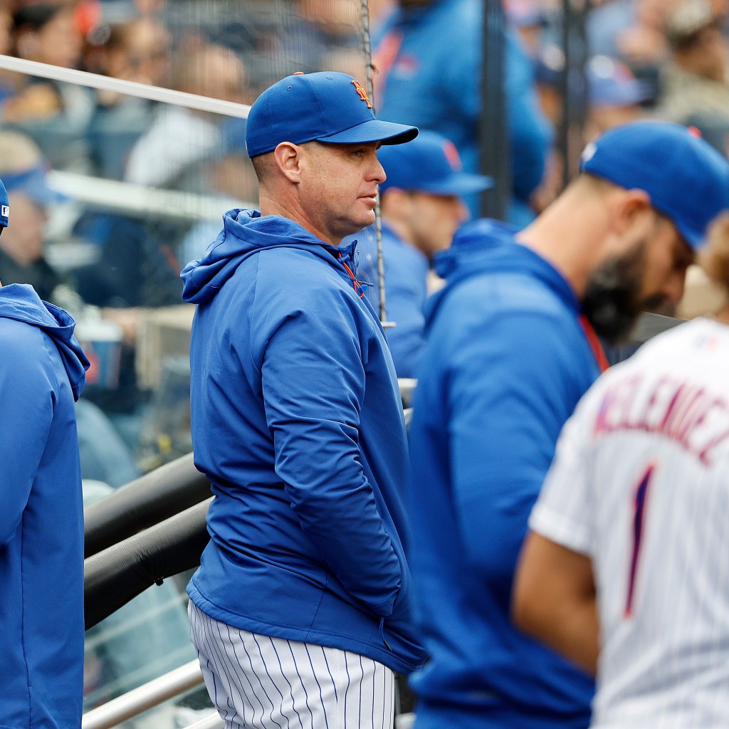 New York Mets manager Carlos Mendoza reacts in the dugout.