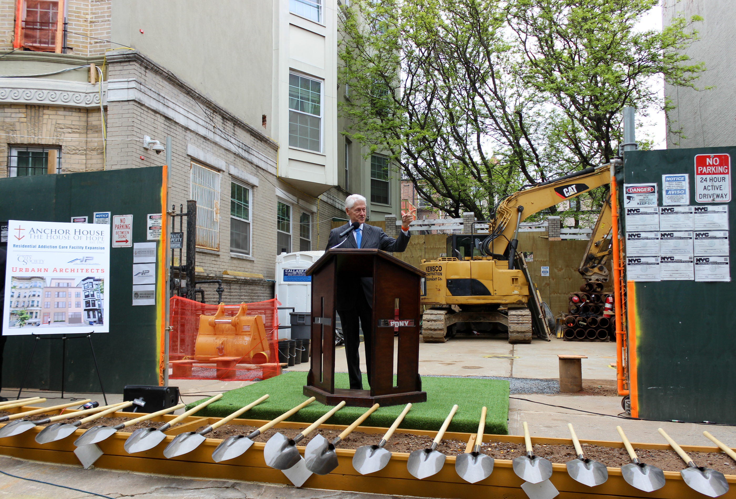 former president bill clinton at a podium