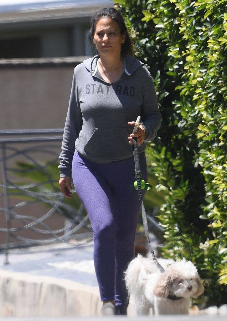 Judie was casually dressed for a walk with her pooch
