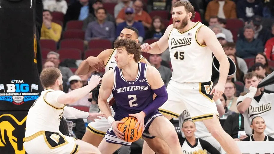 Northwestern forward Nick Martinelli is defended by Purdue guard Braden Smith. Mandatory Credit: David Banks-Imagn Images