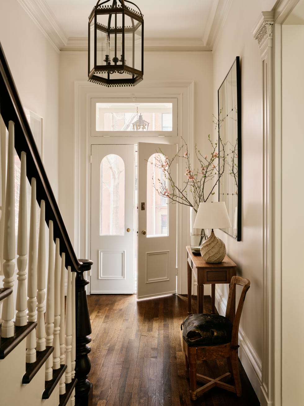 Bright and welcoming front hall with stylish decor