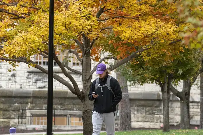 A student walks to class on the campus of Kansas State University in Manhattan, Kansas.