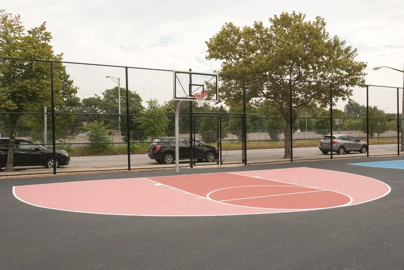 Pink basketball court in the reimagined playground at P.S. 366 in the Bronx. (Trust for Public Land)