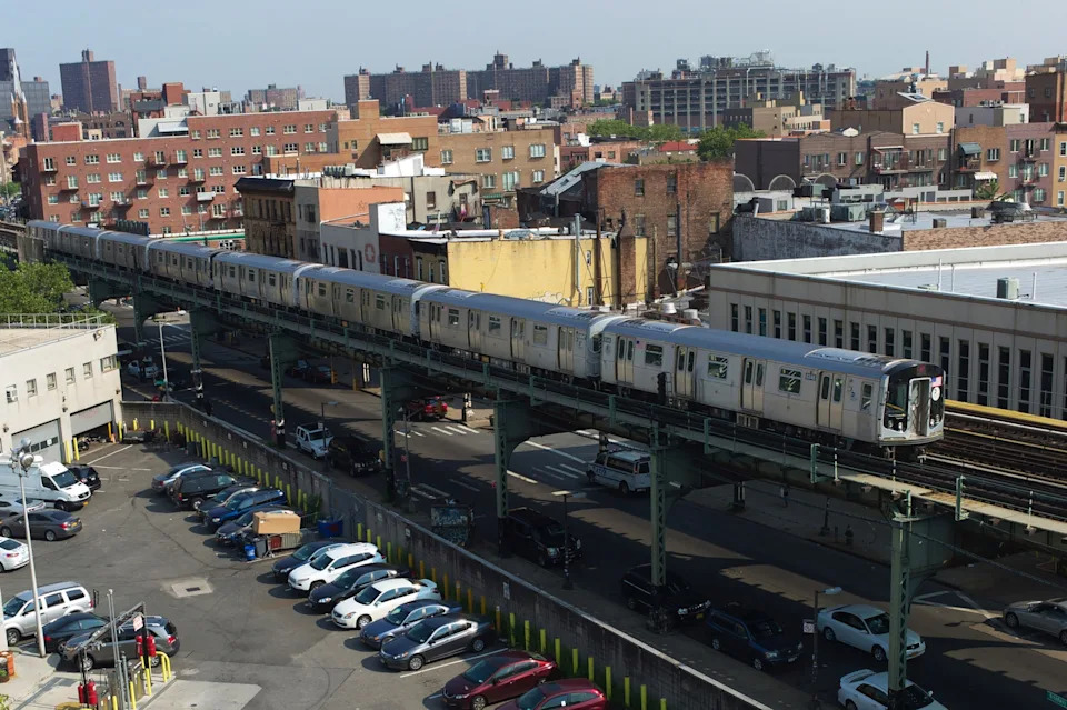Andrew Lichtenstein/Corbis via Getty Images, FILE - PHOTO: In this July 21, 2014, file photo, a J train passes through Williamsburg's south side in New York.