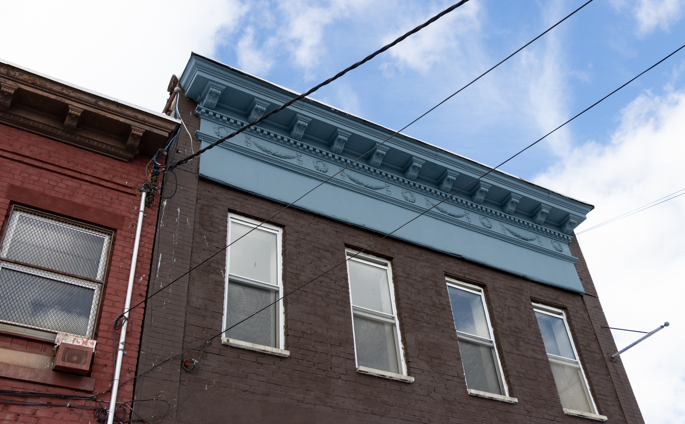 blue cornice ornamented with swags and garlands