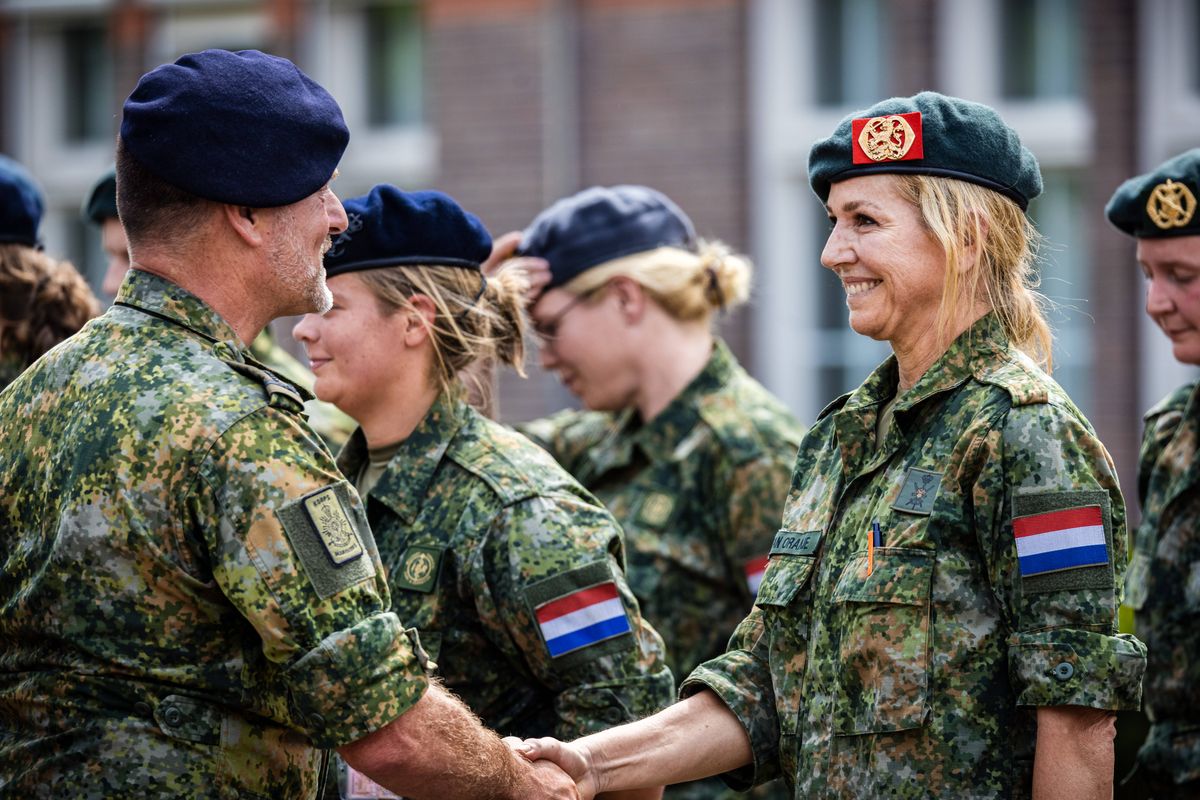 Queen Máxima receives her military beret after successfully completing the first phase of basic military training.