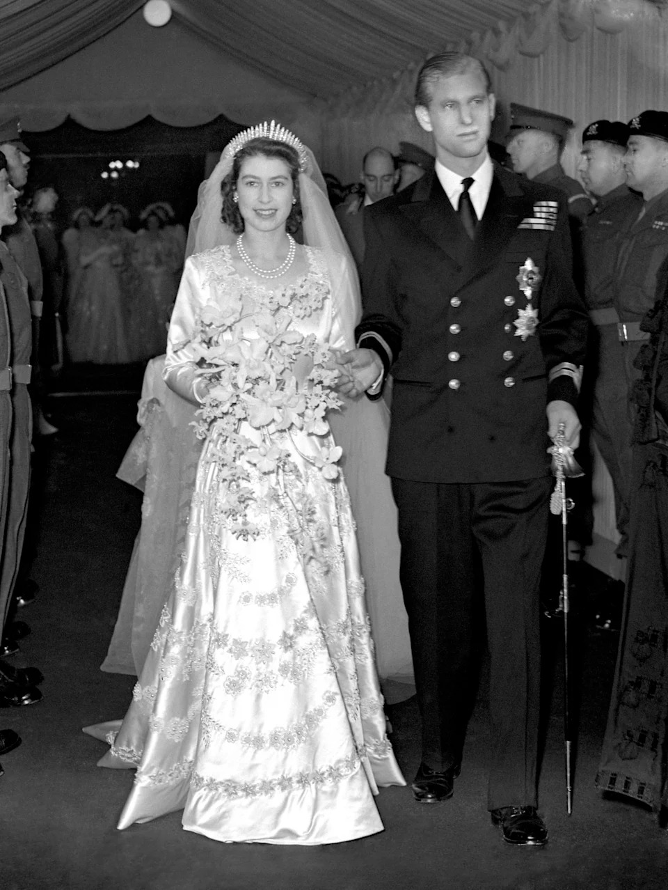 Queen Elizabeth II and her husband Prince Philip, Duke of Edinburgh, leave Westminster Abbey after the wedding ceremony.