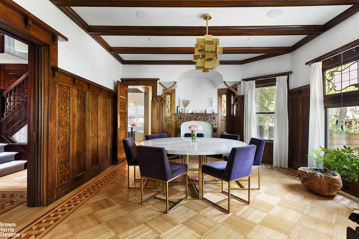 dining room with wainscoting, stained glass