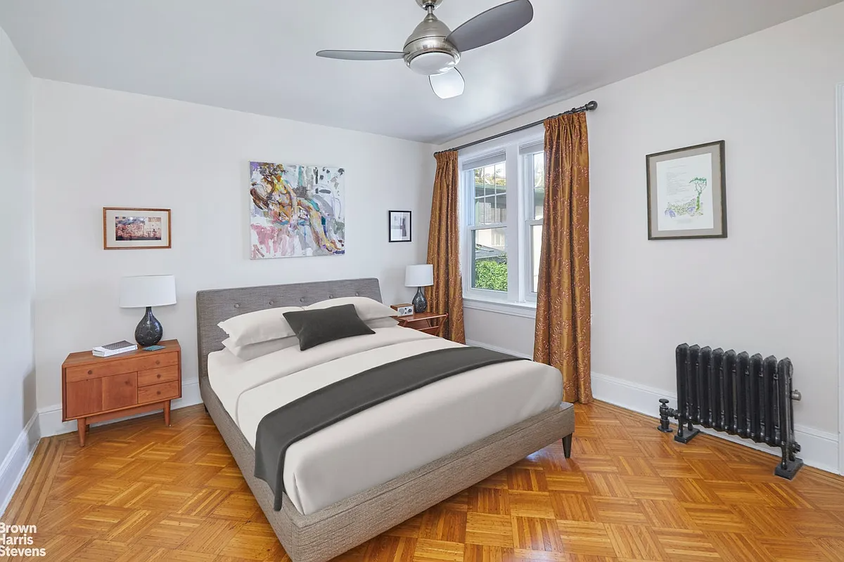 bedroom with wood floor, white walls