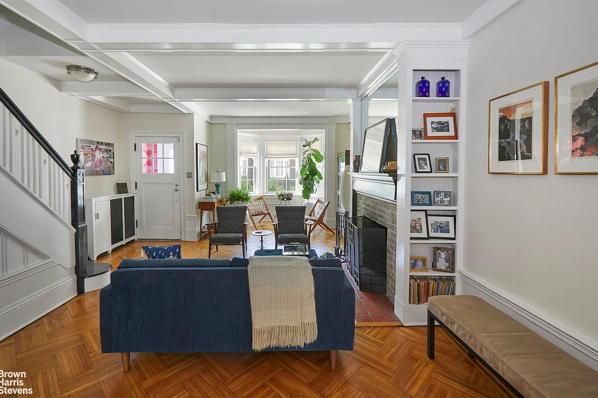 living room with wood floor, white walls