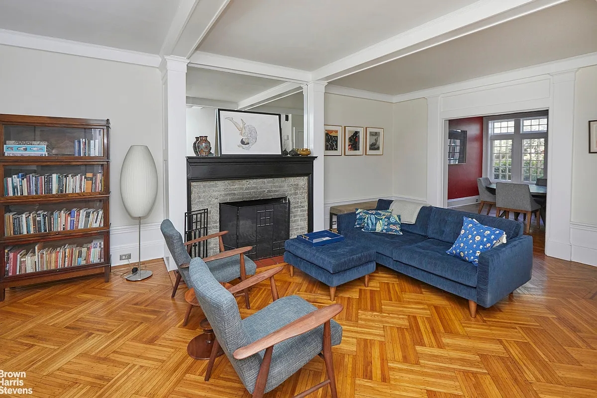 living room with mantel, wood floors
