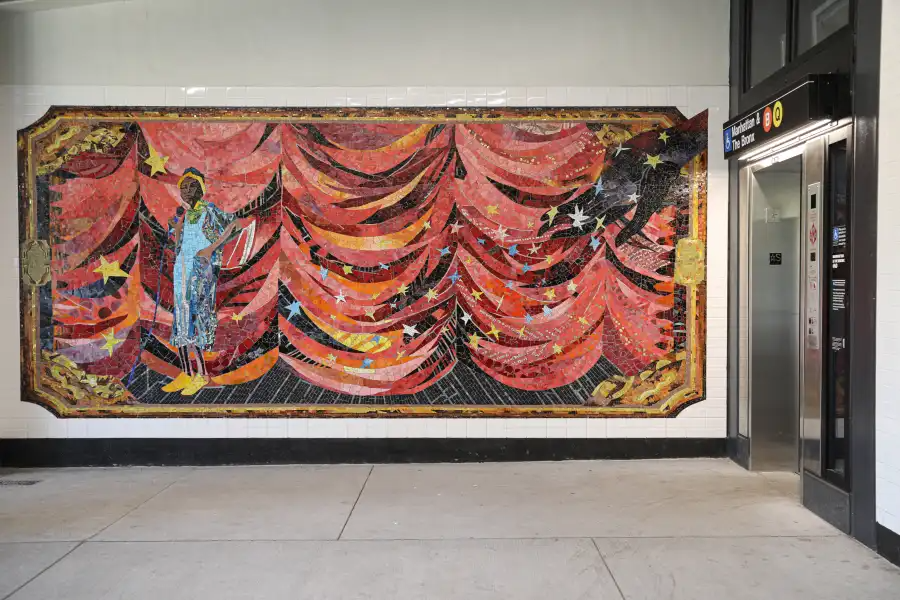 large wall mosaic near an elevator