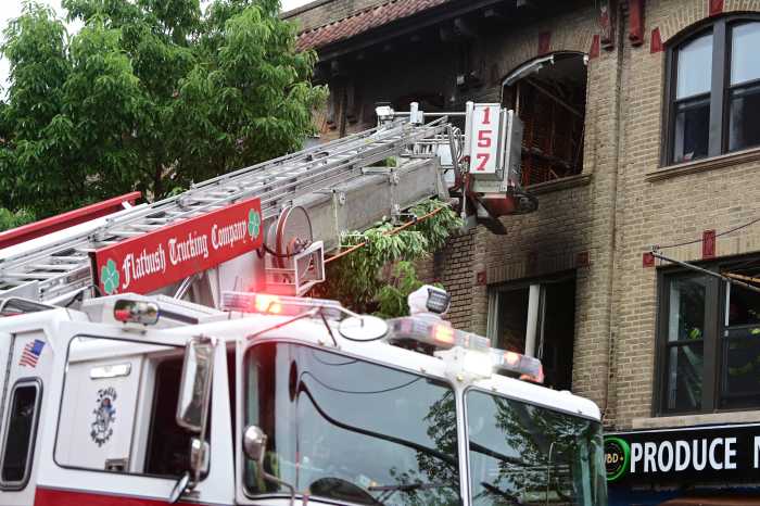 fire truck in front of a damaged building in Brooklyn