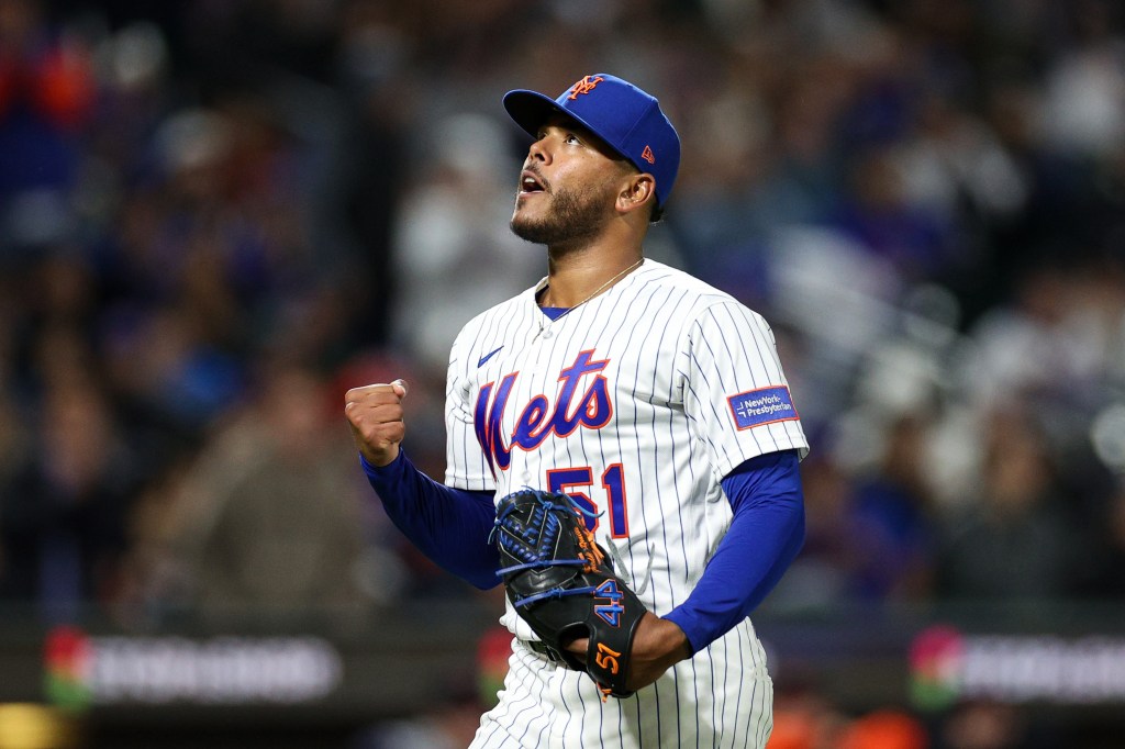 Freddy Peralta #51 of the New York Mets reacts after a play.