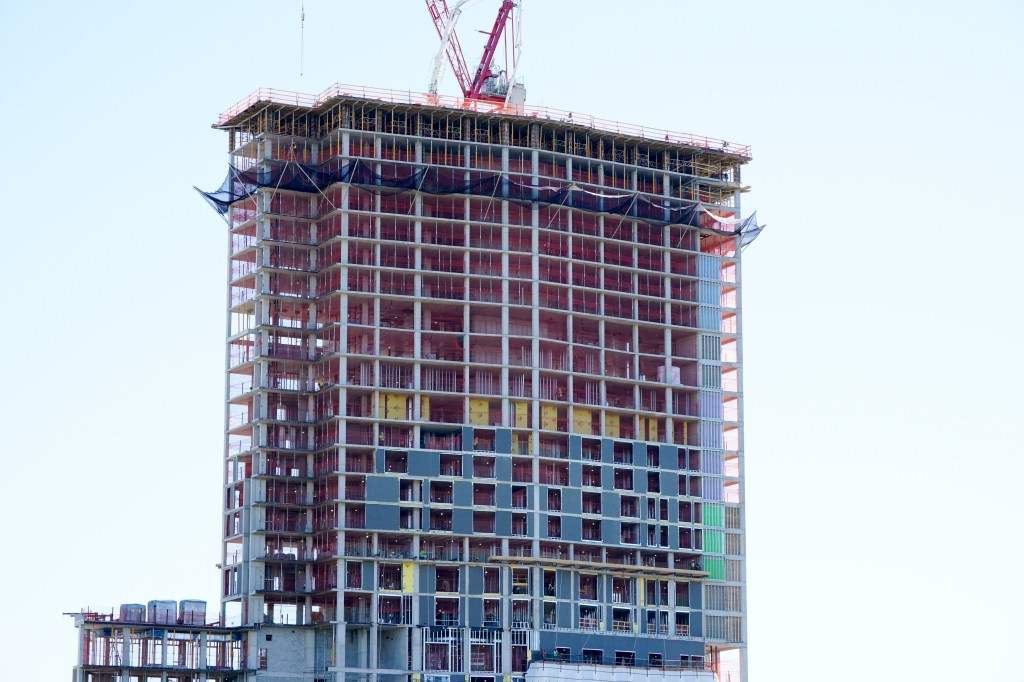 High-rise residential building under construction in the Bronx.