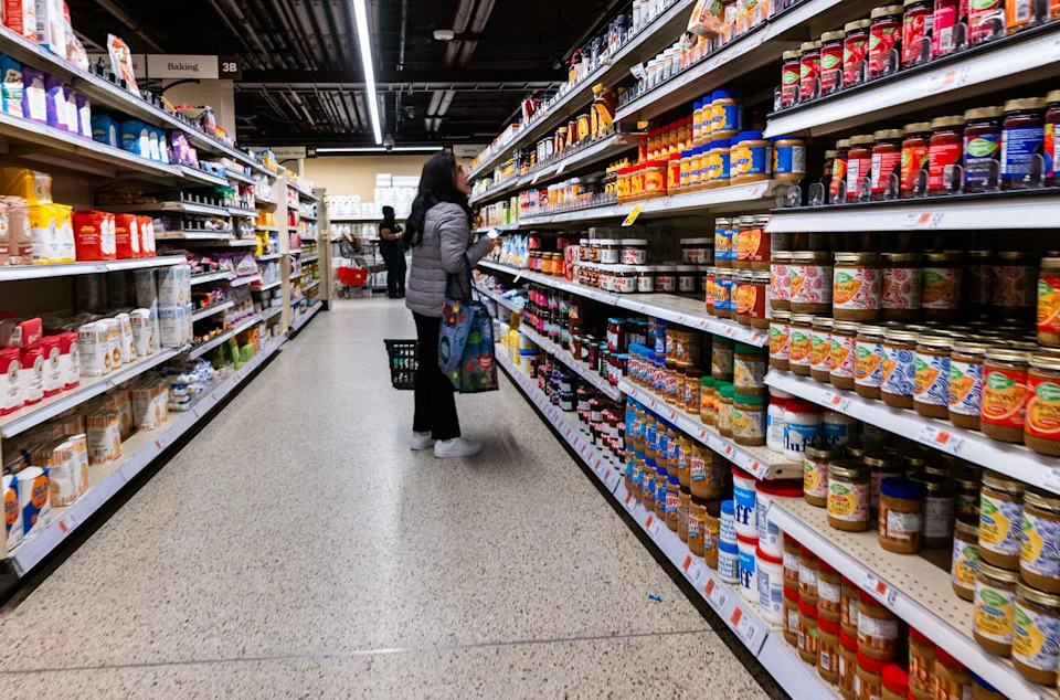 People shop at a grocery store in Manhattan. 