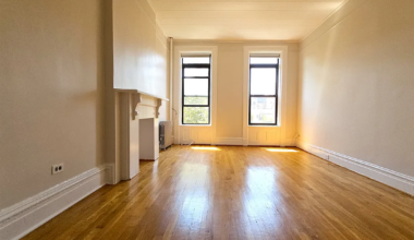 room with mantel, two windows