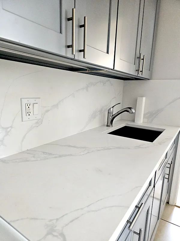 dark kitchen cabinets with white countertop