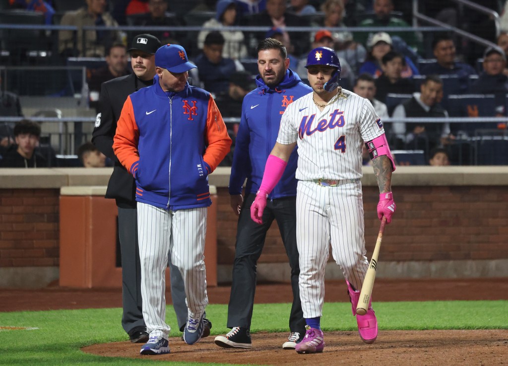 New York Mets catcher Francisco Alvarez is removed from the game after hurting himself on a swing.