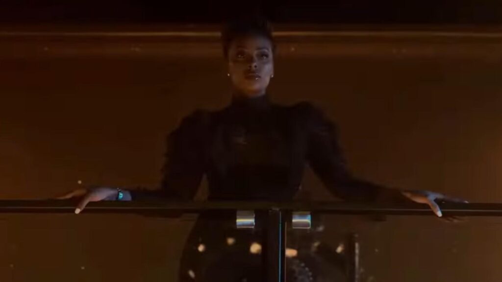 Eva Marcille as Marilyn Madam DeVille watching from balcony, from All The Queens Men Season 4