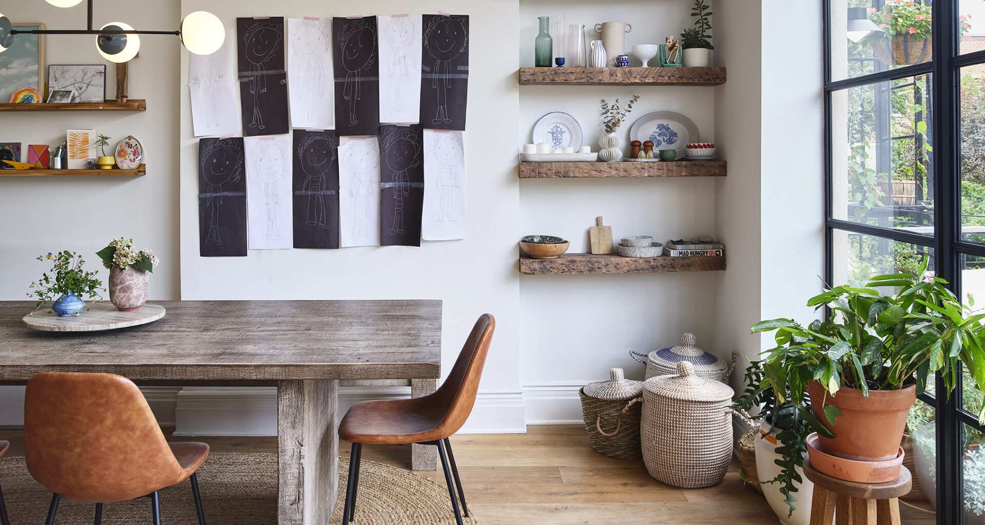 DINING AREA BLACK AND WHITE WALL HANGING GLASS BACK WALL