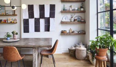 DINING AREA BLACK AND WHITE WALL HANGING GLASS BACK WALL