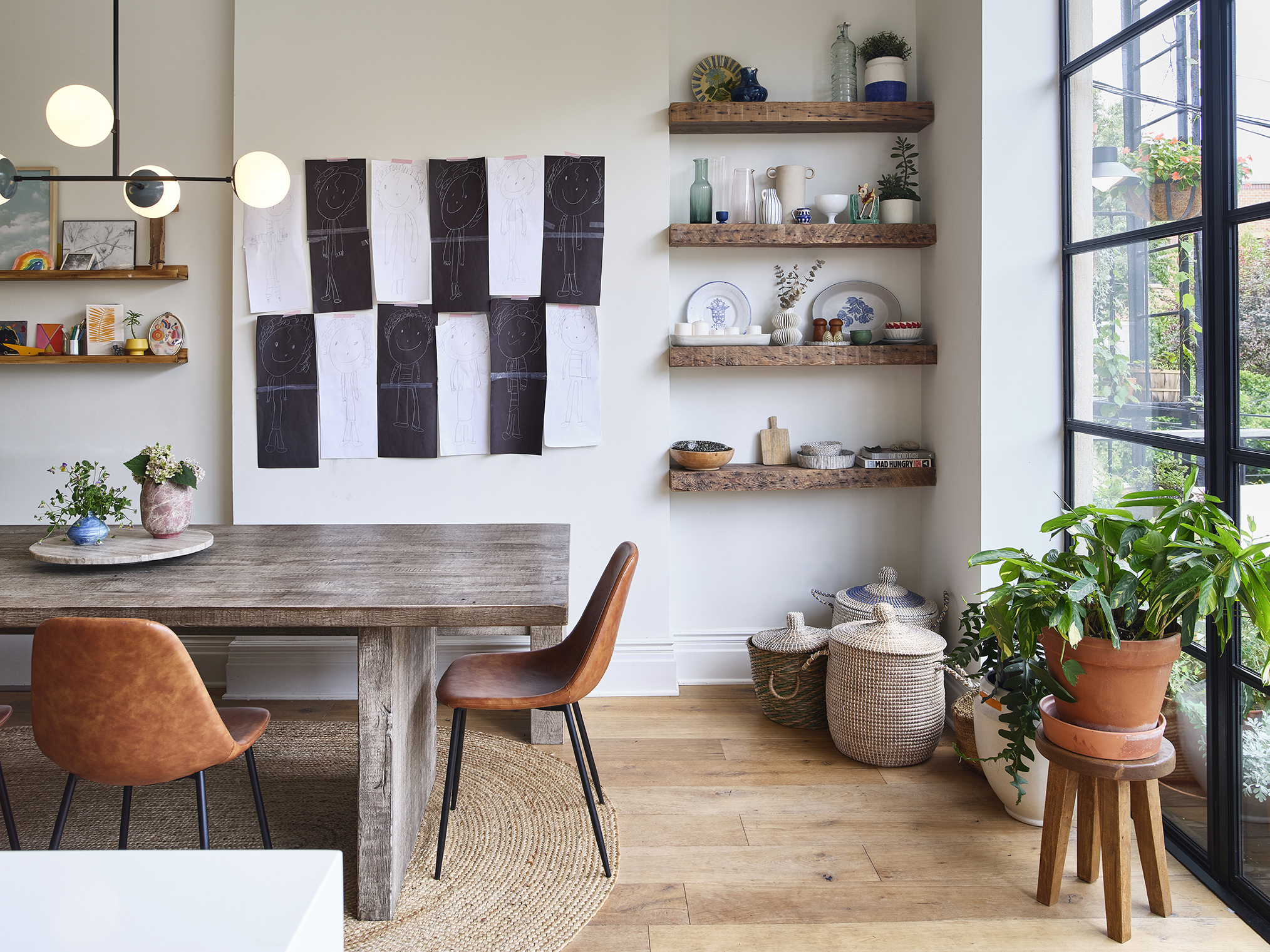 DINING AREA BLACK AND WHITE WALL HANGING GLASS BACK WALL