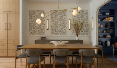 DINING ROOM with modern chandelier and pale wood table