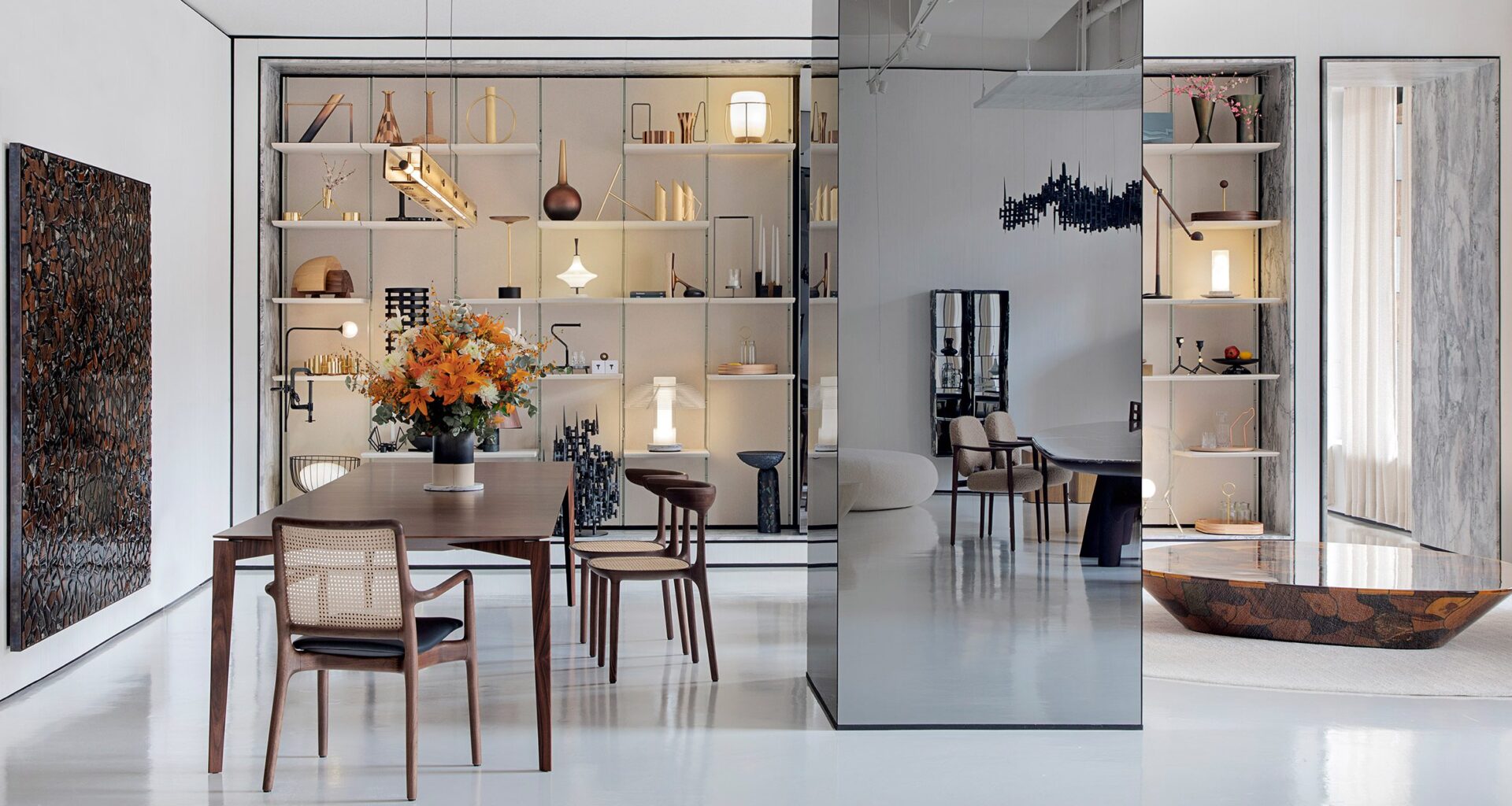 A furniture showroom with seating and lit display shelves