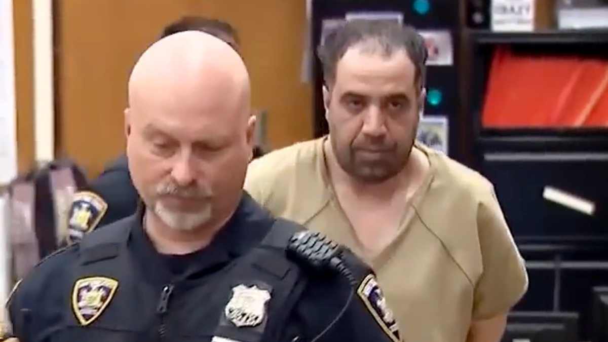 Kamal Semrade is escorted by police in court after being convicted in NYC subway shoving attack