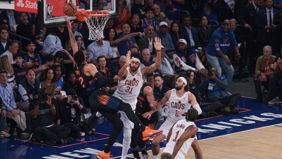 New York Knicks C Karl-Anthony Towns goes to the rack on the Cleveland Cavaliers C Jarrett Allen at Madison Square Garden during the 2026 Eastern Conference Finals.