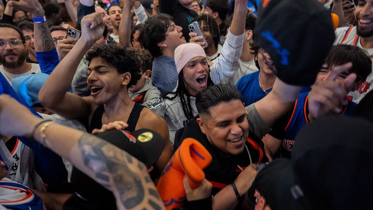 Knicks fans celebrating in New York City after winning eastern conference championship