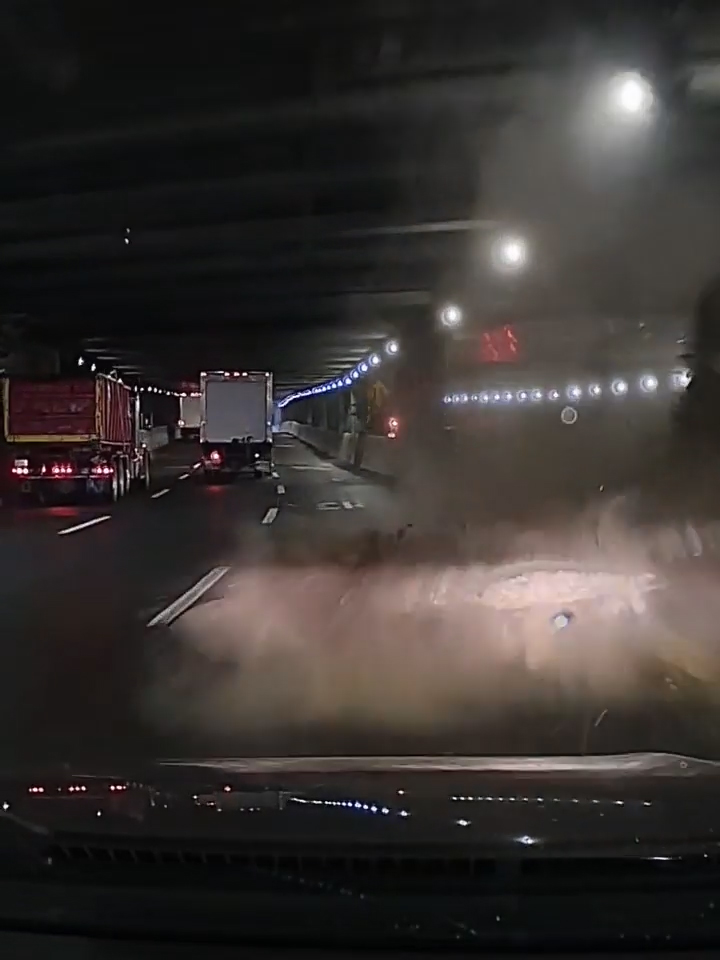 Debris falling from the ceiling of a dark tunnel on the Trans-Manhattan Expressway.