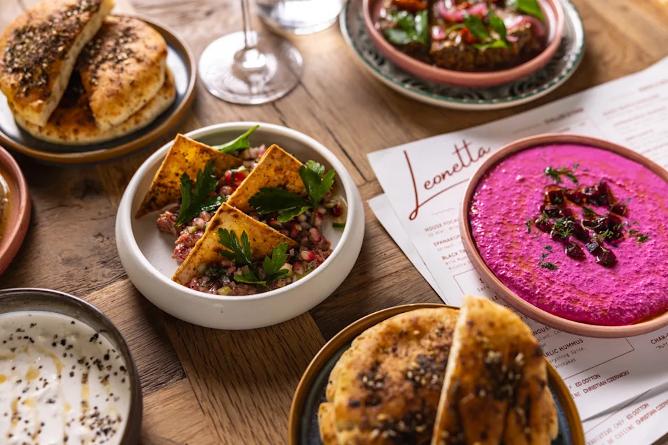 Stone-fired pitas with dips and mezze dishes at Leonetta restaurant NYC